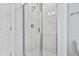 Modern bathroom shower features sleek glass enclosure and elegant white marble tile surround at 757 Portland Rose Dr, Knightdale, NC 27545