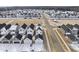 Aerial view of a neighborhood with houses and snow on the ground at 80 Blue Iris Pkwy # 129, Clayton, NC 27520