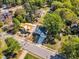 Aerial view showcasing the new home, neighboring houses, tree-lined street, and a partially constructed house at 113 S Ennis St, Fuquay Varina, NC 27526