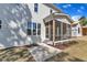 Exterior view of house with a screened porch and concrete patio at 113 S Ennis St, Fuquay Varina, NC 27526