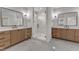 Bright bathroom with marble floors, double vanity, and glass shower at 113 S Ennis St, Fuquay Varina, NC 27526