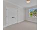 Bright bedroom with a double door closet and a lovely natural light from a window at 113 S Ennis St, Fuquay Varina, NC 27526