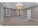 Spacious bedroom with decorative ceiling and a walk-in closet at 113 S Ennis St, Fuquay Varina, NC 27526