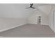 Large bonus room with carpet and neutral walls provides versatility at 113 S Ennis St, Fuquay Varina, NC 27526