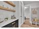 Inviting hallway area with custom cabinets, floating shelves and convenient built-in bench at 113 S Ennis St, Fuquay Varina, NC 27526