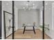 Stylish home office with glass doors, modern lighting, and neutral decor at 113 S Ennis St, Fuquay Varina, NC 27526