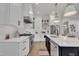 Modern kitchen with white cabinets, stainless steel appliances, and stylish countertops at 113 S Ennis St, Fuquay Varina, NC 27526