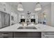 Kitchen island featuring a sink and dishwasher, with an open view to the Gathering room at 113 S Ennis St, Fuquay Varina, NC 27526