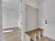 Welcoming mudroom boasts a cozy bench and convenient wall hooks at 113 S Ennis St, Fuquay Varina, NC 27526