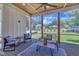 Relaxing screened porch with comfortable seating and view of the backyard at 113 S Ennis St, Fuquay Varina, NC 27526