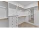 Spacious walk-in closet with custom shelves, drawers and a large mirror at 113 S Ennis St, Fuquay Varina, NC 27526