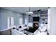 Living room with a stone fireplace and built-in shelving at 6021 Inverness Cir, Sanford, NC 27332