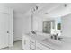Bright bathroom with double sinks, white cabinets, quartz countertop, and shower at 929 Kinglet House Rd, Knightdale, NC 27545