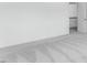 An open-concept bedroom featuring neutral carpet and fresh paint at 929 Kinglet House Rd, Knightdale, NC 27545