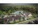 Wide shot of community pool and lounge area featuring a clubhouse, parking, and landscaping at 929 Kinglet House Rd, Knightdale, NC 27545
