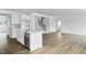 Modern kitchen with an island, stainless steel appliances, and hardwood floors at 929 Kinglet House Rd, Knightdale, NC 27545