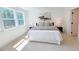 Bright bedroom with large windows, a comfortable bed, and contemporary decor at 2126 Opulent Oaks Ln # 14, Durham, NC 27713