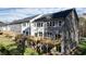 Townhomes with gray siding, white accents, decks, and fenced backyard at 2126 Opulent Oaks Ln # 14, Durham, NC 27713