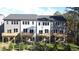 Townhomes with gray siding, white accents, decks, and fenced backyard at 2126 Opulent Oaks Ln # 14, Durham, NC 27713