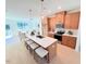 Open kitchen with a central island, stylish pendant lighting, and a seamless view into the living area at 2126 Opulent Oaks Ln # 14, Durham, NC 27713