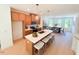 Modern kitchen featuring a large island with seating and a seamless transition to the dining area at 2126 Opulent Oaks Ln # 14, Durham, NC 27713