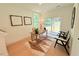 Bright office space with hardwood floors, a modern desk, and sliding glass doors leading to the backyard at 2126 Opulent Oaks Ln # 14, Durham, NC 27713