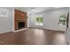 Living room featuring a brick fireplace and hardwood floors at 426 S Hillsborough St, Franklinton, NC 27525