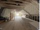 View of an unfinished attic, prepped with spray foam insulation, ready for build-out and finishing at 7000 North Ridge Dr, Raleigh, NC 27615
