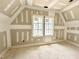 Unfinished attic space with window showing the potential for a bonus room at 7000 North Ridge Dr, Raleigh, NC 27615