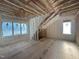 Finished attic space showing spray foam insulation, rafters and natural light at 7000 North Ridge Dr, Raleigh, NC 27615