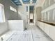 Bathroom with tile walls, awaiting finishing touches and fixtures, showcasing its potential at 7000 North Ridge Dr, Raleigh, NC 27615