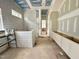 Bathroom showcasing a tiled tub, white cabinets, and under-construction elements at 7000 North Ridge Dr, Raleigh, NC 27615
