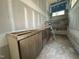 Bathroom with a custom vanity under construction, with a view of the shower under construction in the background at 7000 North Ridge Dr, Raleigh, NC 27615