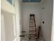 Walk-in shower stall ready for finishing touches in a well lit bathroom at 7000 North Ridge Dr, Raleigh, NC 27615