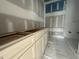 Bathroom showing vanity with drawers and base cabinets waiting for countertop at 7000 North Ridge Dr, Raleigh, NC 27615