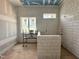 Bathroom featuring a tiled bathtub, large windows, and under-construction elements at 7000 North Ridge Dr, Raleigh, NC 27615