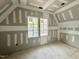 Sunlit bedroom with large windows, perfect for relaxation and personalization at 7000 North Ridge Dr, Raleigh, NC 27615