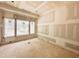 Bedroom with a large window overlooking yard, ready for your personal touch and design at 7000 North Ridge Dr, Raleigh, NC 27615