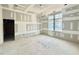 Bright bedroom under construction with large windows, ready to be personalized at 7000 North Ridge Dr, Raleigh, NC 27615