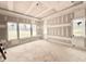 Spacious bedroom with large windows providing ample natural light and scenic outdoor views at 7000 North Ridge Dr, Raleigh, NC 27615