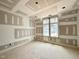 Spacious bedroom with large window offering lots of natural light under construction at 7000 North Ridge Dr, Raleigh, NC 27615