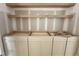Cabinetry with custom shelving providing ample storage space and ready for customization at 7000 North Ridge Dr, Raleigh, NC 27615