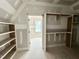 Bright closet showing custom shelving and trimwork near completion at 7000 North Ridge Dr, Raleigh, NC 27615