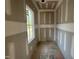 A well-lit closet featuring ample storage space and construction ready for your organizational needs at 7000 North Ridge Dr, Raleigh, NC 27615
