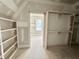 Spacious walk-in closet with lots of storage space and shelves under construction at 7000 North Ridge Dr, Raleigh, NC 27615