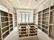 Large walk-in closet with custom shelving and drawers, providing ample storage options at 7000 North Ridge Dr, Raleigh, NC 27615