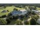Aerial view showcasing the clubhouse amidst the lush golf course and country club at 7000 North Ridge Dr, Raleigh, NC 27615