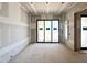 Dining room featuring sliding glass doors to backyard and adjoining doorway to an adjacent room at 7000 North Ridge Dr, Raleigh, NC 27615