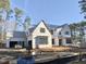 View of a new home's exterior under construction, featuring Homestead Guard house wrap at 7000 North Ridge Dr, Raleigh, NC 27615