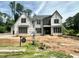 New construction home featuring a modern design with a neutral color palette and large windows at 7000 North Ridge Dr, Raleigh, NC 27615